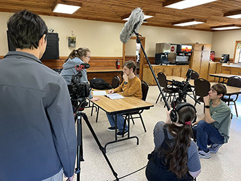 4-H members filming a scene.