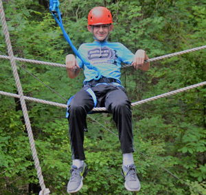 excel participant on ropes course